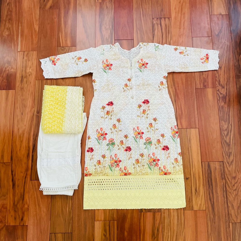 Three piece yellow and white floral salwar kameez